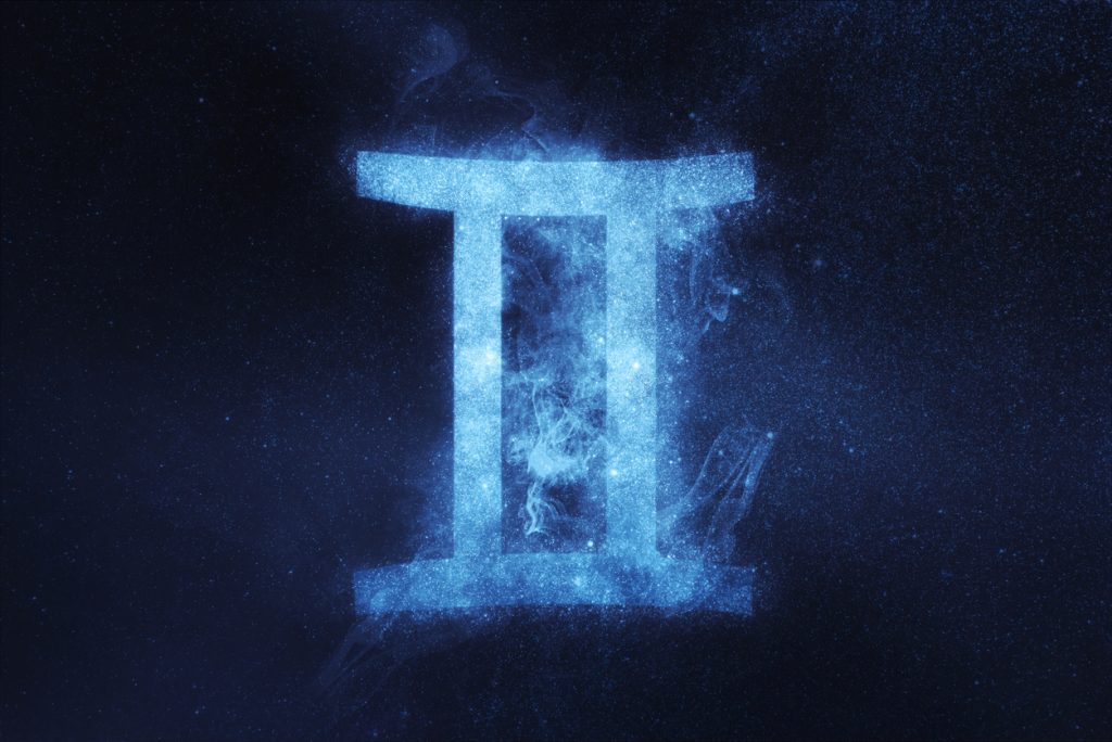 Gemini zodiac sign on a night background