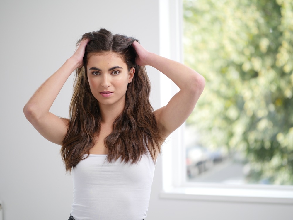 Female model running  hand through her hair