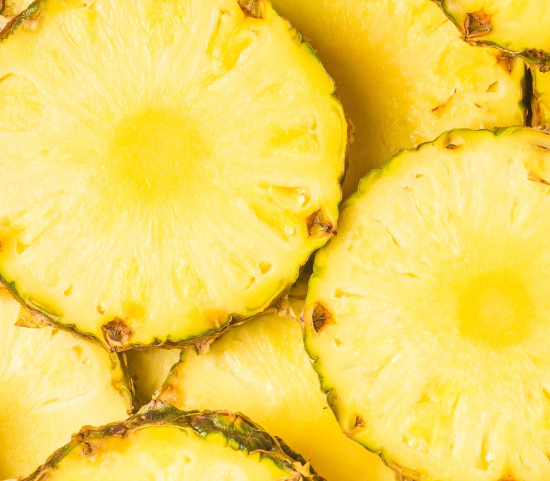 close up of pile of pineapple slices