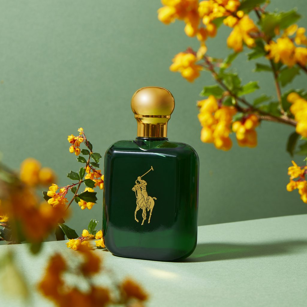 Polo by Ralph Lauren green bottle with yellow flowers and green background