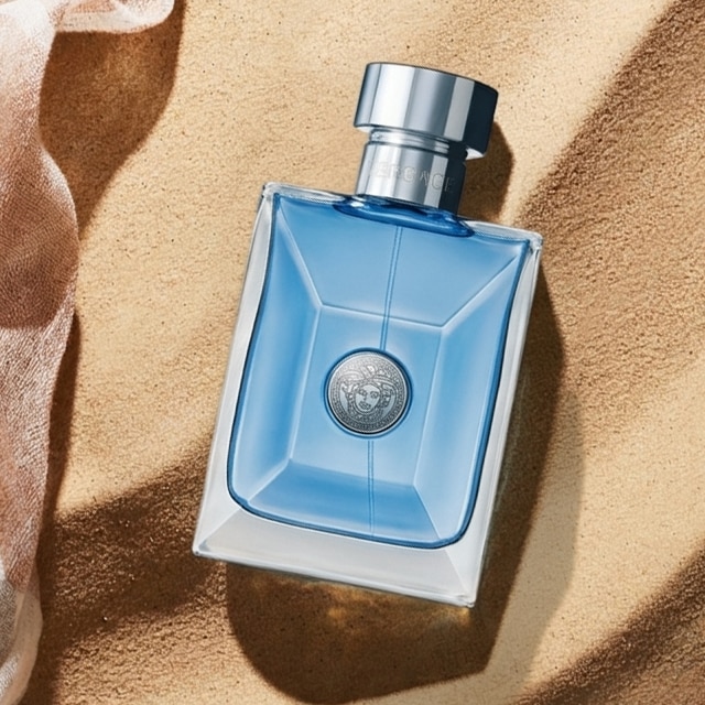 Image of aftershave on sand backdrop