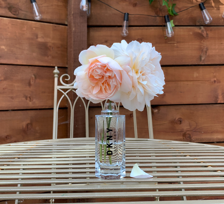 Upcycled perfume bottle with flowers