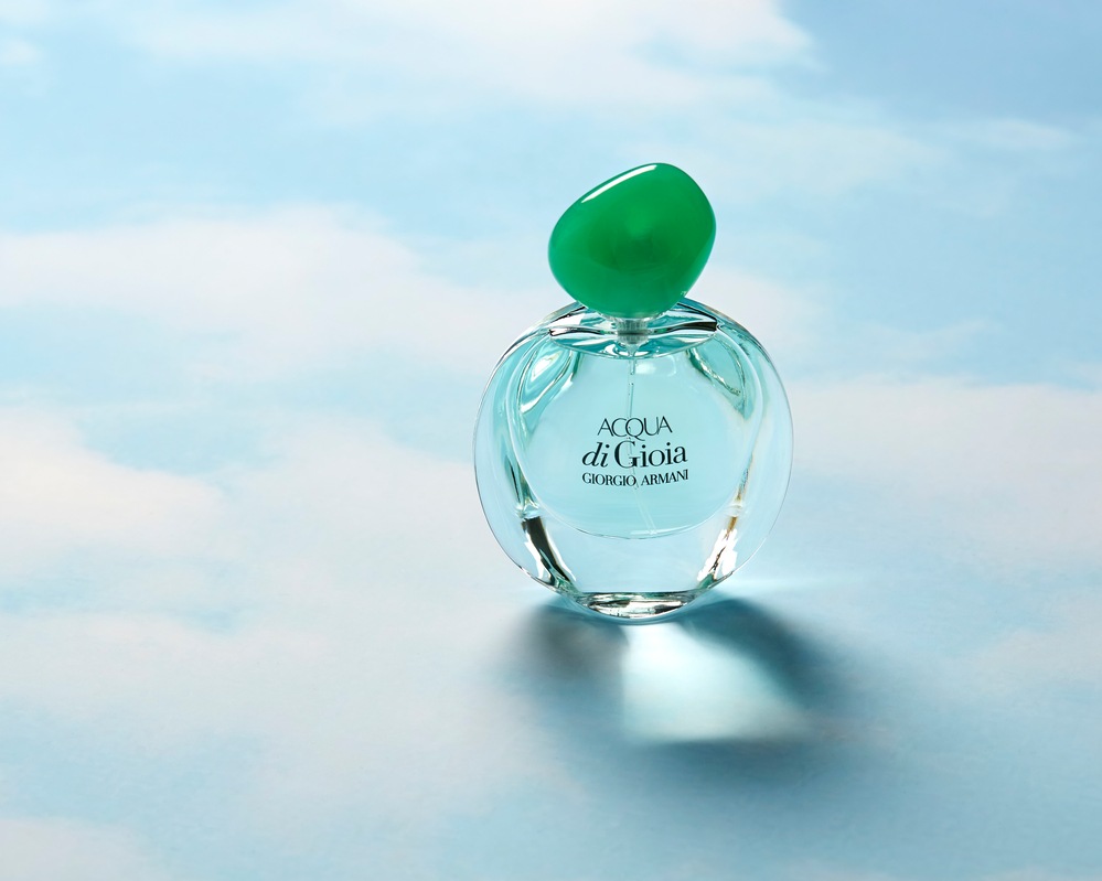 Acqua de Gioia by Giorgio Armani on cloudy blue background