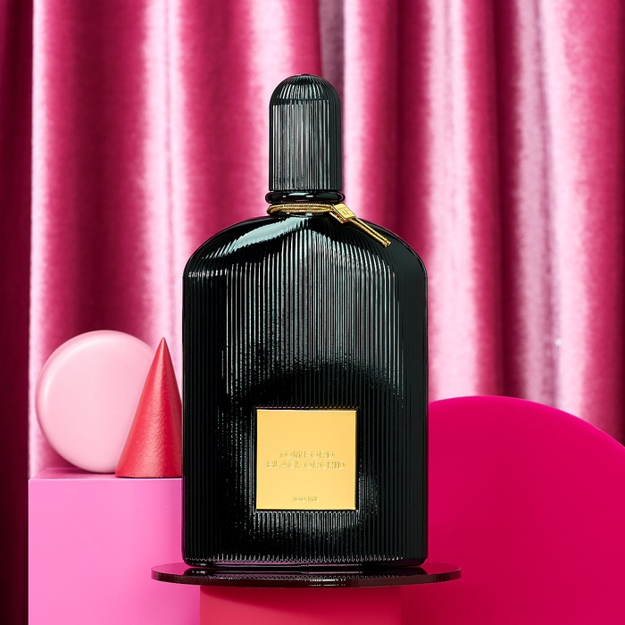 Black Orchid by Tom Ford on standwith pink background