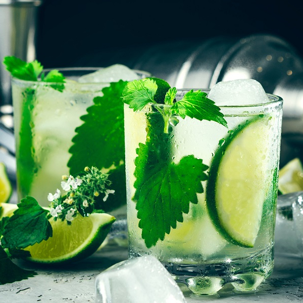 Mojito cocktail in glass with ice lime and mint