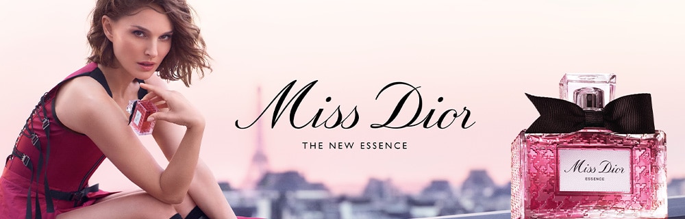 Miss Dior Essence bottle with model