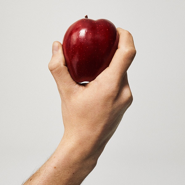 Hand holding apple
