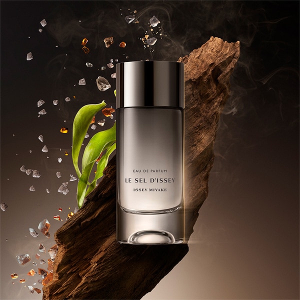 Le Sel bottle with woody notes in background