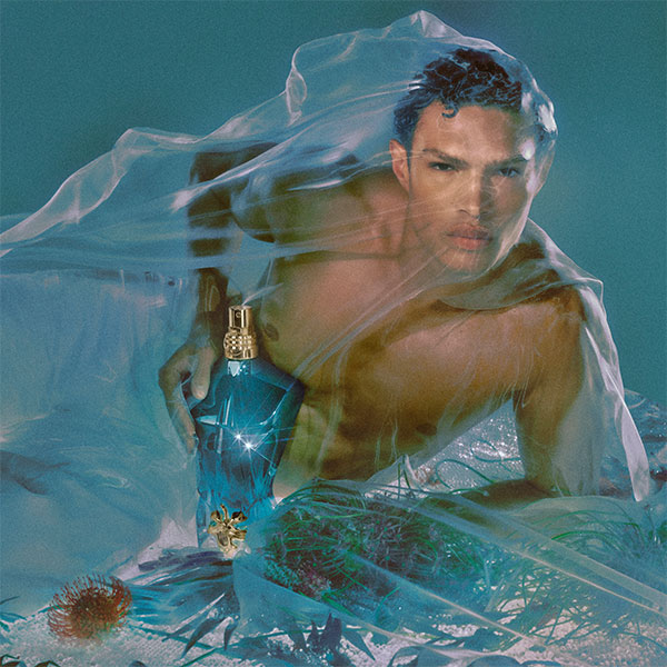 Lifestyle image of model and bottle