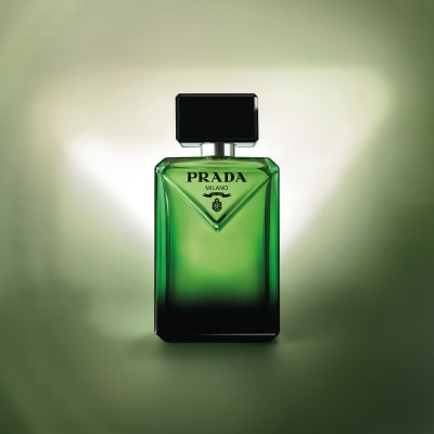 Paradigme bottle against a green background