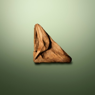 Image of Sandalwood arranged in the shape of a triangle on a green background