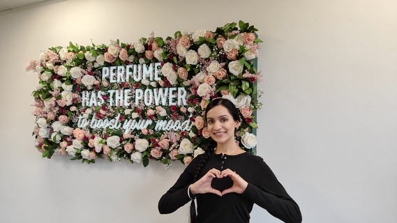 Women holding a heart synbol with her hands