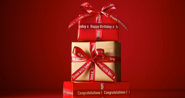 Boxes wrapped with personalised ribbon done by The Perfume Shop