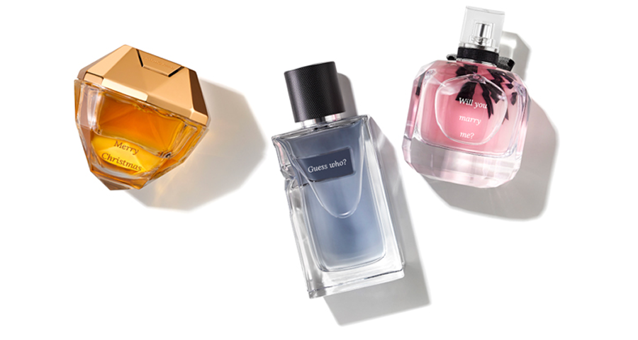 3 engraved perfume bottles flat lay on a table