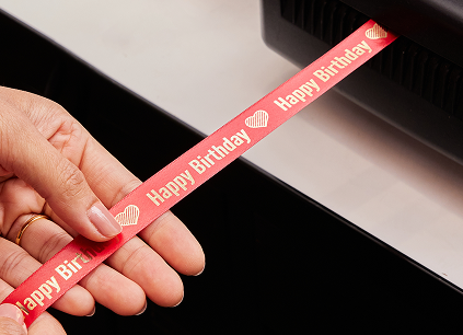 A personalised ribbon saying 'happy birthday'