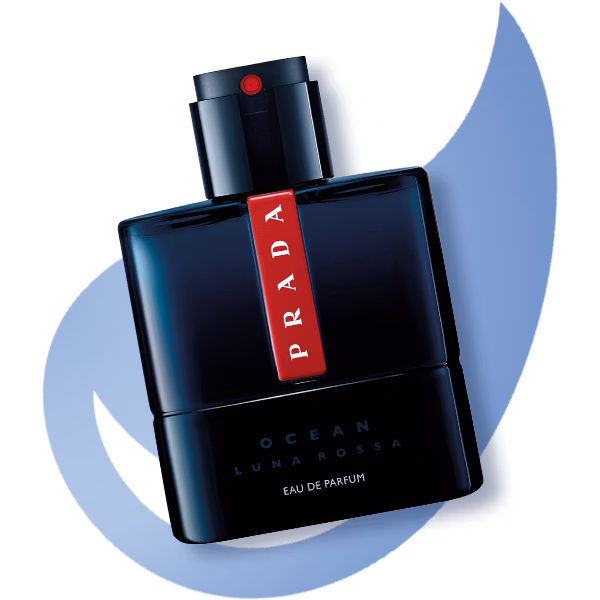 A bottle of prada luna rossa ocean laid flat on a blue water droplet shape
