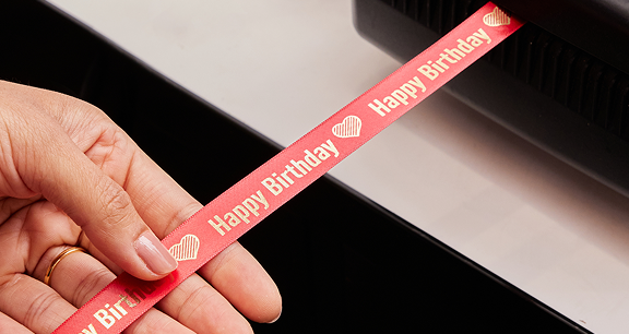 A personalised ribbon saying 'happy birthday'
