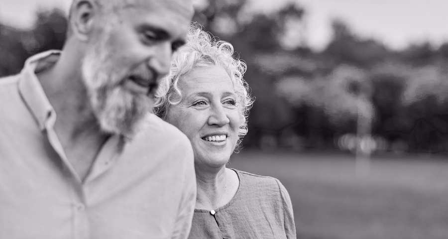 A older couple smiling the camera