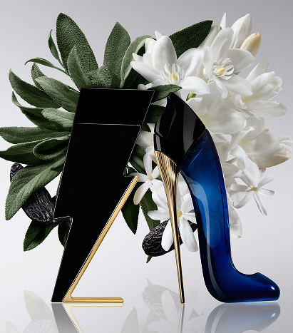 A bottle of Good Girl and Bad Boy with leaves and flowers behidn them