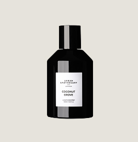 A black bottle or fragrance with a white label on it