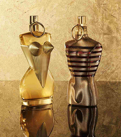 Two Jean Paul Gaultier bottles with a gold background