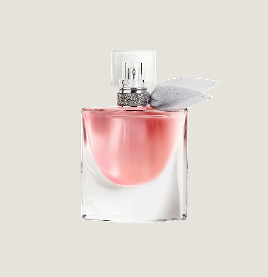 A pink bottle with a bow around the neck