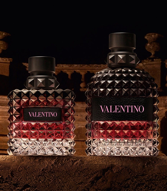 Two bottles of Valentino Born in Roma in the Colosseum at night