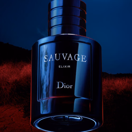 A bottle of the elixir with a desert at night behind