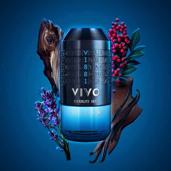 Lifestyle marketing image for Cerruti 1881 VIVO Elixir Eau de Parfum showing the fragrance bottle placed prominently in the foreground, with the reflective metallic cap and blue‑to‑amber gradient glass catching warm, dramatic lighting. The dark, atmospheric background and contrasting highlights emphasise the bottle’s bold, modern design and the fragrance’s intense, masculine character.