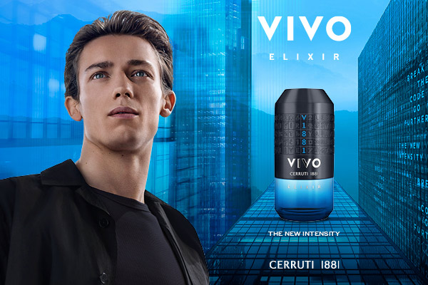 Lifestyle fragrance image for Cerruti 1881 VIVO Elixir Eau de Parfum, showing the bottle displayed in a dramatic, low‑light setting. The metallic blue‑anthracite cap and sculpted glass bottle with a blue‑to‑amber gradient catch warm highlights, while the dark background and subtle reflections reinforce the fragrance’s bold, intense, and contemporary character.