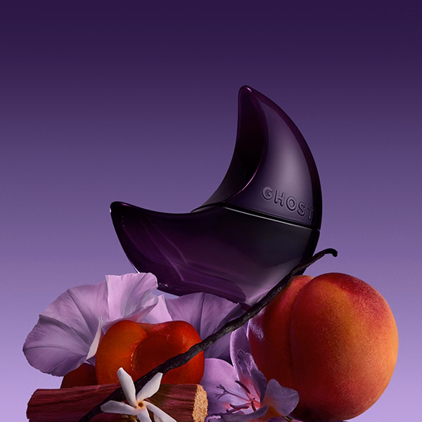 A bottle of Ghost Deep night on some flowers and a peach