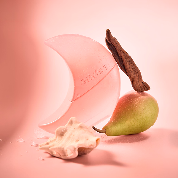 A bottle of Ghost Lunar Goddess with a pink background and a pear