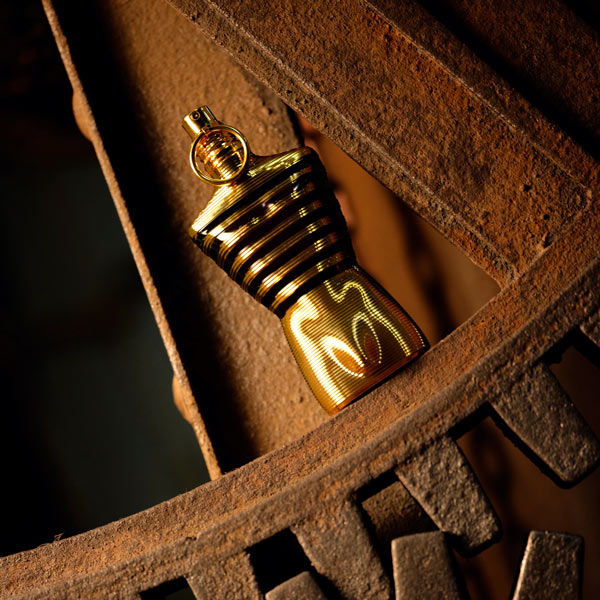 JPG le male perfume bottle on rusted gear