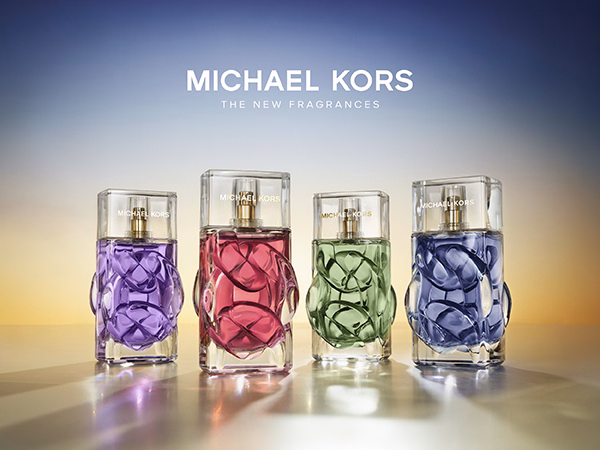 A collection of all the Michael Kors new fragrances with a sunset like background