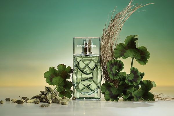 Michael Kors green infinity with ingredients around it