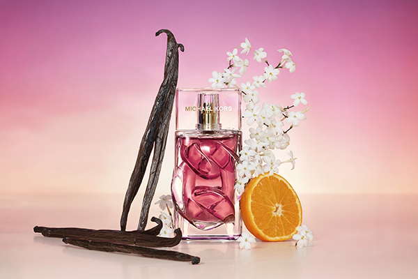 Michael Kors Pink Horizon with ingredients around it