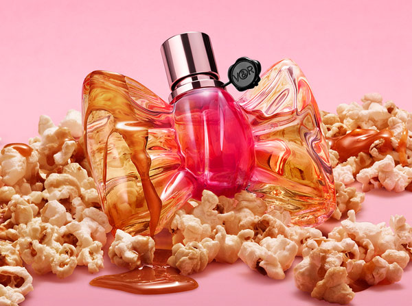 Viktor & Rolf Bonbon caramel crunch perfume bottle placed around popcorn