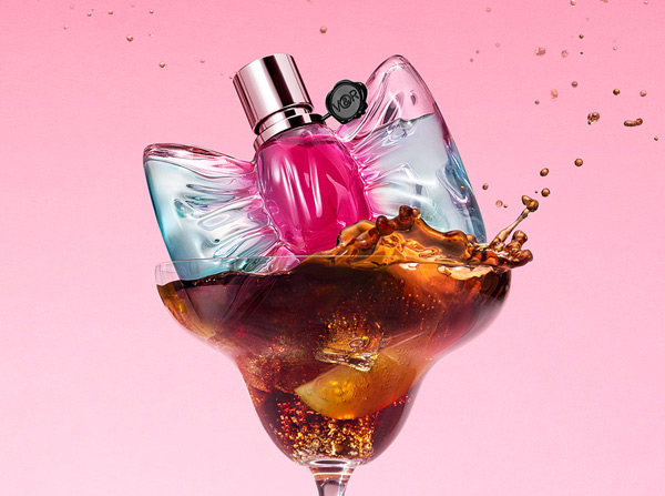 Viktor & Rolf Bonbon cola fizz perfume bottle dropped inside of a cocktail galss with cola liqud splashing